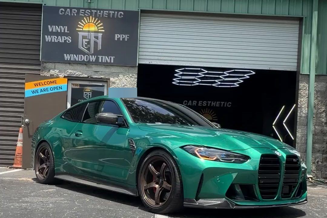 The Car Esthetic shop in Orlando with a green BMW M4 out front