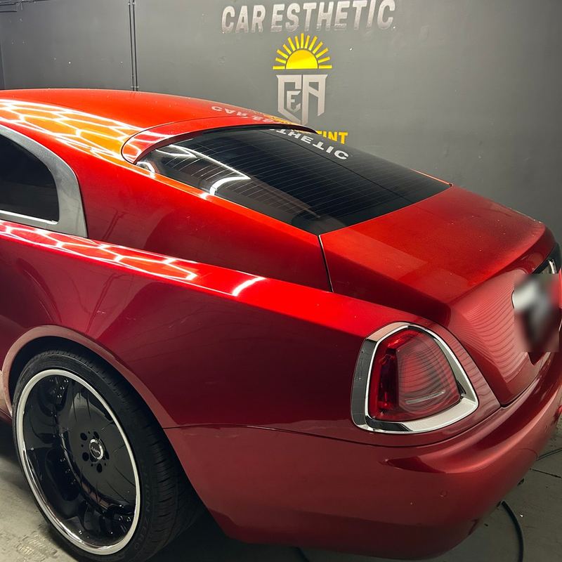 Red Rolls-Royce Wraith with tinted rear glass